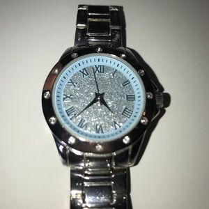 Sliver watch with blue sparkly face.